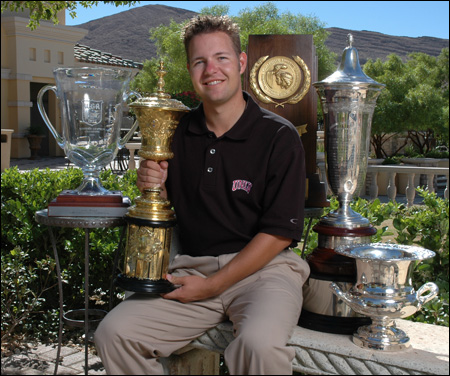 In 2004, Ryan Moore sat surrounded by trophies from that year's victories, including (left to right) the Western Amateur, U.S. Amateur, NCAA individual title, U.S. Amateur Public Links, and the Sahalee Players Championship. 