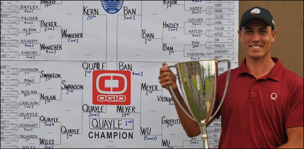 Anthony Quayle, winner of the 114th Pacific Northwest Men's Amateur Championship, poses with the Macan Cup in front of the final scoreboard.