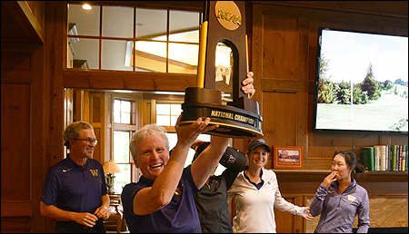 At a reception held at Aldarra Golf Club in Sammamish, Wash. a couple weeks after the victory, Mary Lou Mulflur hoisted the national championship trophy for all to see. Aldarra is one of the region's clubs at which the UW women's golf team has practice privileges. (Photo by Bob Sherwin)