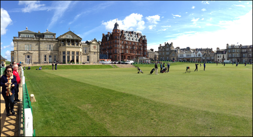 After waiting nine hours, the author hits his tee shot on the first hole at the Old Course, with seemingly half the townspeople watching.