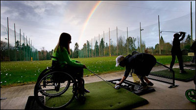 Lorien Welchoff (left) and Wade Chosvig are among the 400 participants in the Mobility Impaired Golf Association in Tigard, Ore. (USGA/Steven Gibbons)
