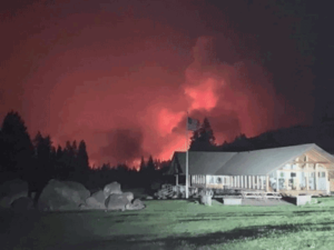 Flames bore down on the Tokatee clubhouse at night.