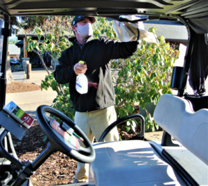 Matt Kyriax, Indian Creek Golf Shop Manager sterilizing carts.