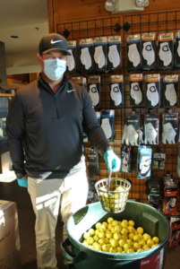 Tyson Jacobs, owner-manager of Indian Creek Golf Course with sanitized range balls.