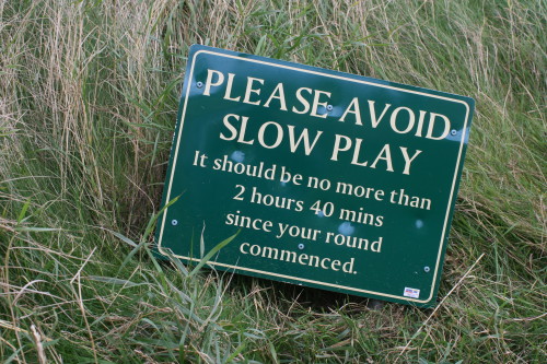 Telling golfers to hurry up, but politely.