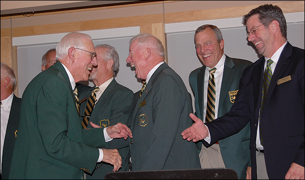 George-Holland-is-greeted-on-the-stage-at-Caddie-Hall-of-Fame-induction