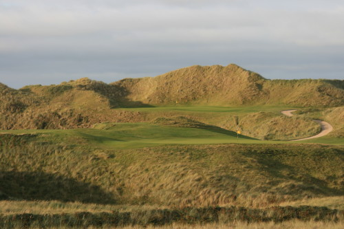The 12th green and, behind it, No. 13 green at Tralee Golf Links in Ireland.